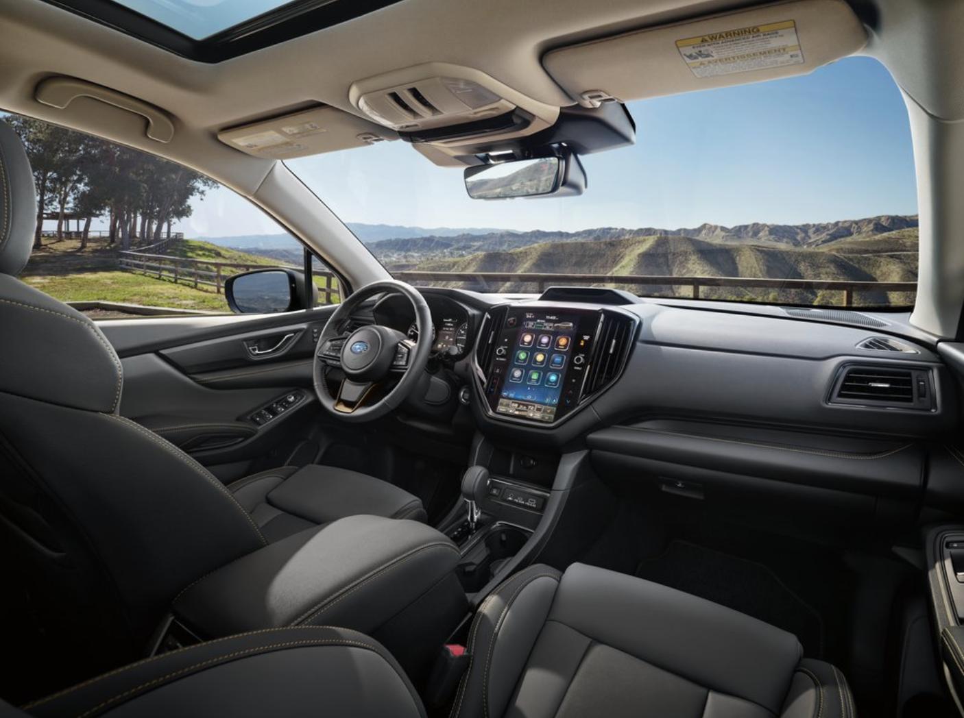 2026 Subaru Ascent dashboard with 11.6-inch vertical touchscreen and mountain view