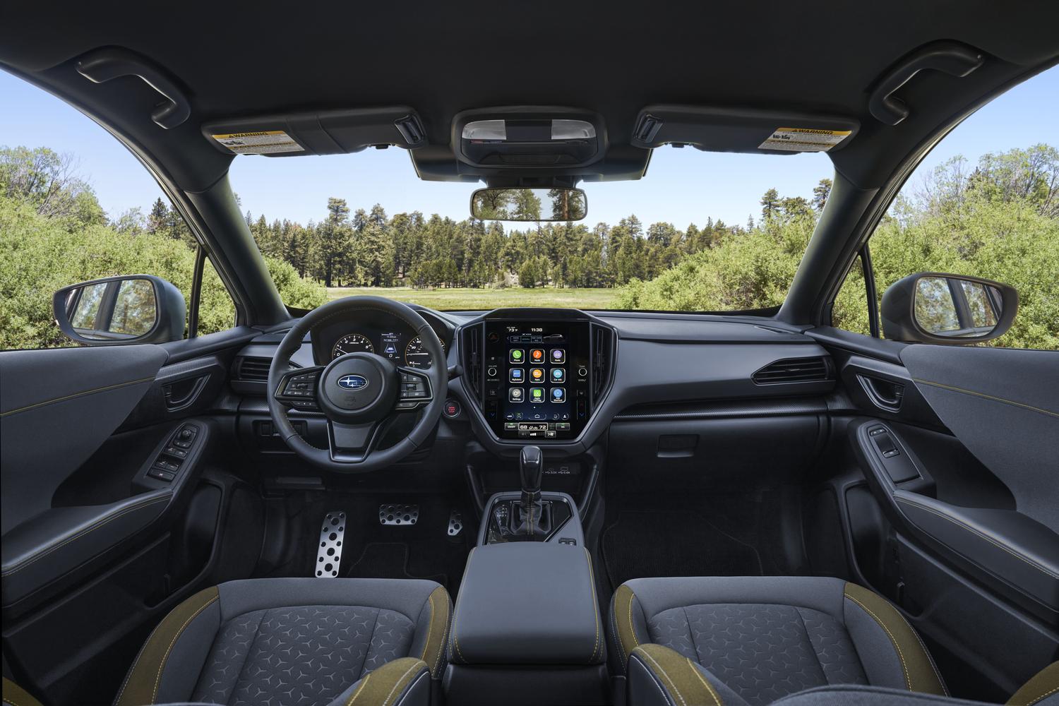 2026 Subaru Crosstrek dashboard and multimedia touchscreen viewed from the rear seat