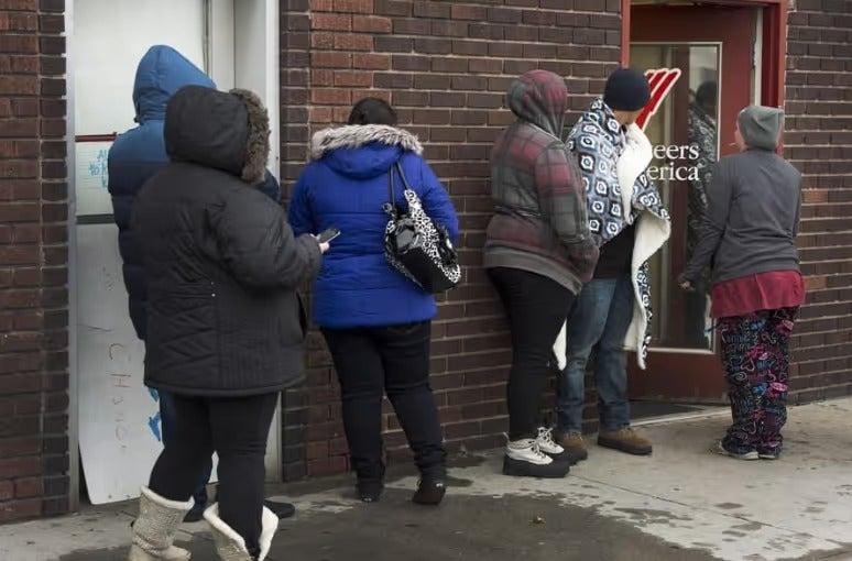 People in winter coats gathered outside a donation drive in Salt Lake City