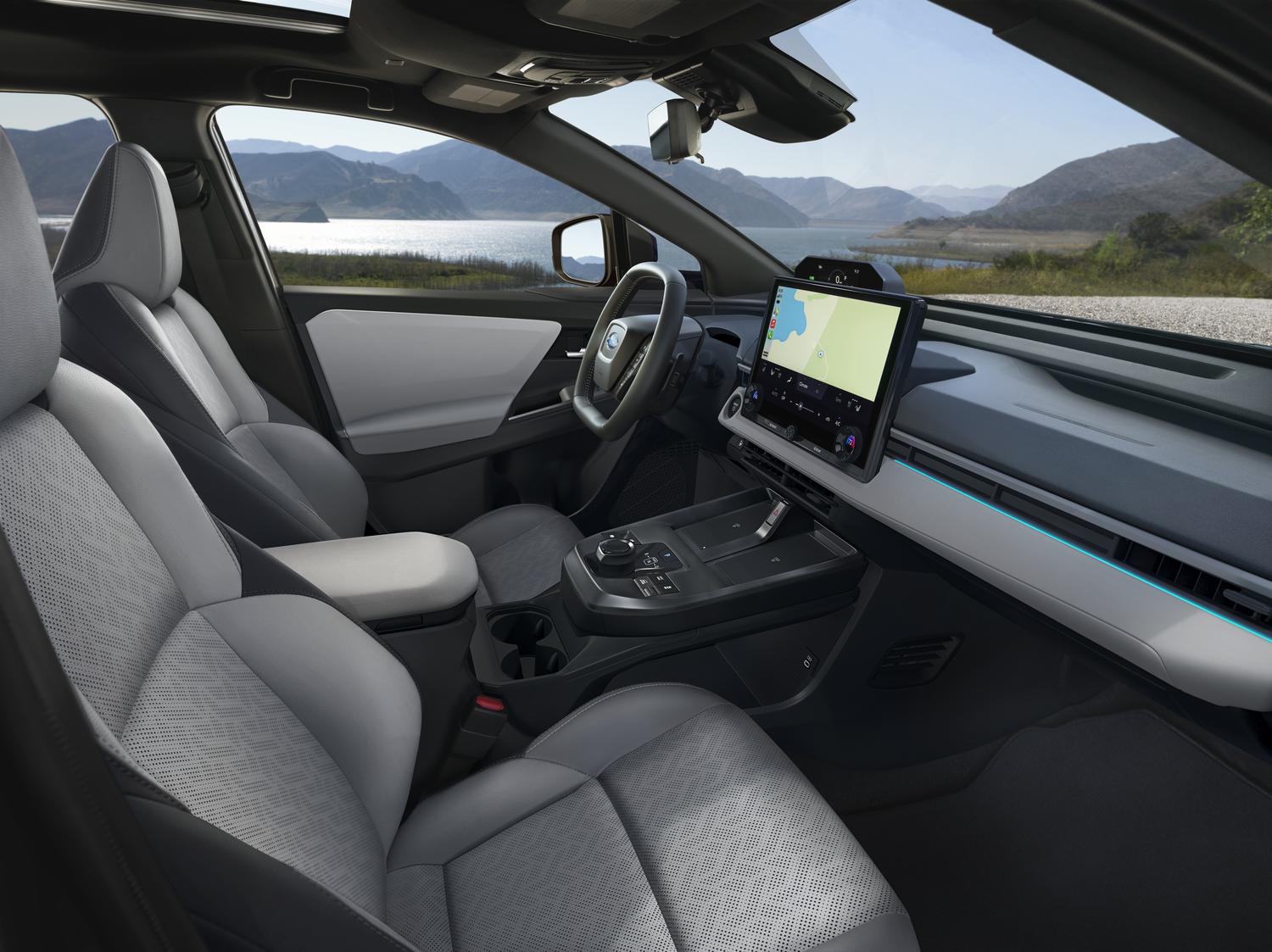 2026 Subaru Solterra interior with light gray seating and large center touchscreen